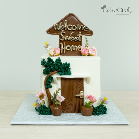 Welcome Sweet Home cake with flowers and door decoration"