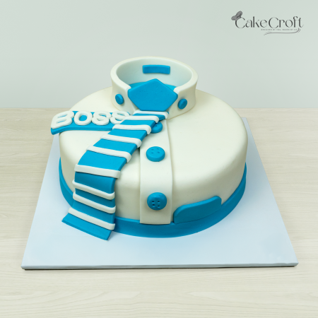 Boss-themed cake with a blue and white collar and tie design.