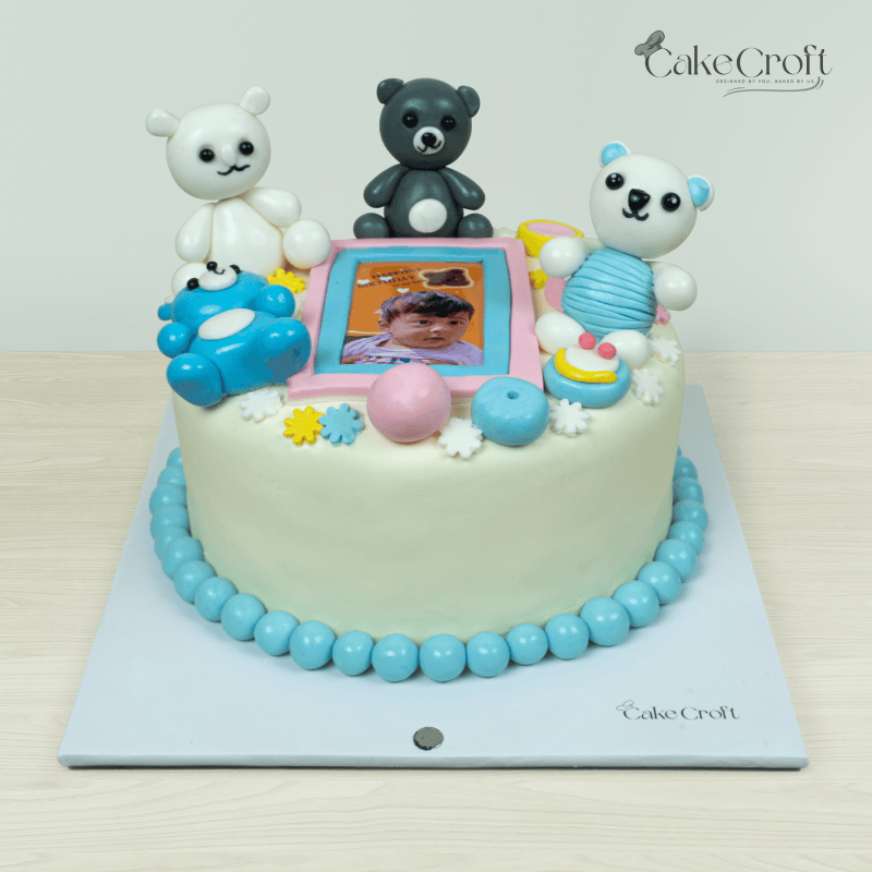 Teddy bear-themed photo cake decorated with teddy figures and colorful elements