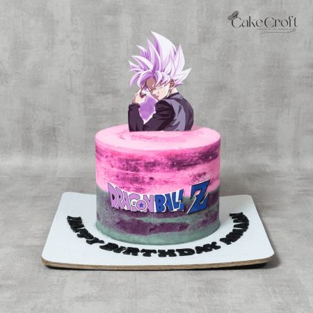 A Dragon Ball Z-themed birthday cake featuring a pink and purple gradient design with an edible Goku Black (Super Saiyan Rosé) topper.