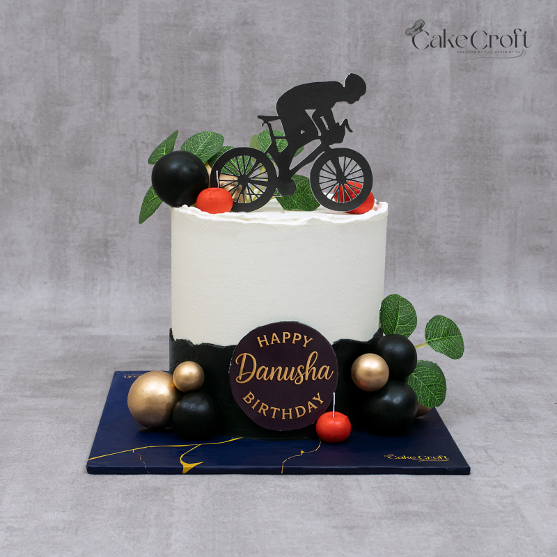 A modern cycling-themed cake perfect for biking lovers.