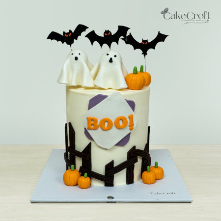 Halloween ghost cake with “BOO” fondant topper, pumpkins, bats, and ghosts by CakeCroft Dhaka.