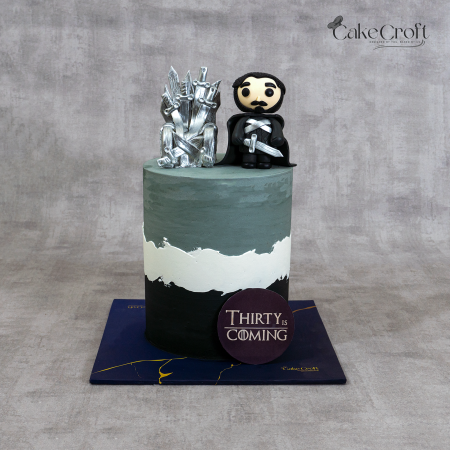 Game of Thrones themed fondant cake with Iron Throne and Jon Snow figure on grey ombre base by CakeCroft Dhaka.