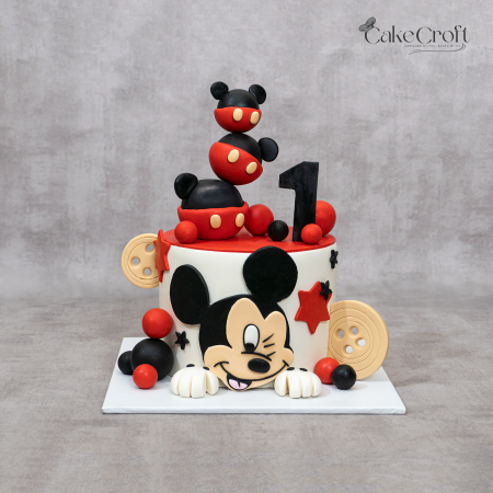 Mickey Mouse themed fondant birthday cake in red, black, and cream with 3D Mickey topper and number one design by CakeCroft Dhaka.