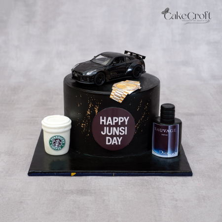 Luxury men’s black fondant cake with Dior perfume, Rolex watch, car, and Starbucks toppers by CakeCroft Dhaka.