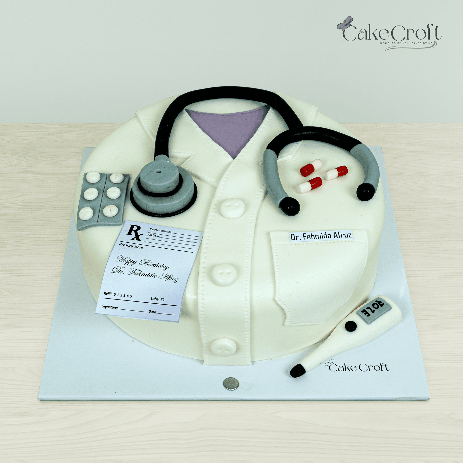 Doctor coat theme fondant cake with stethoscope and medical details in Dhaka