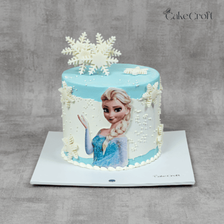 Frozen Elsa snowflake birthday cake in ice blue and white fondant