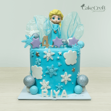 Elsa Frozen themed birthday cake with snowflakes and icy blue design in Dhaka