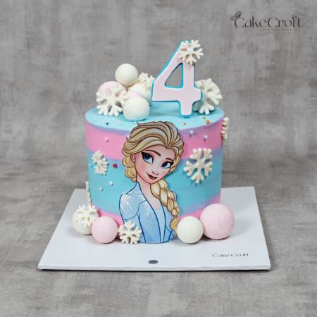 Pastel Frozen princess birthday cake with Elsa design and snowflakes