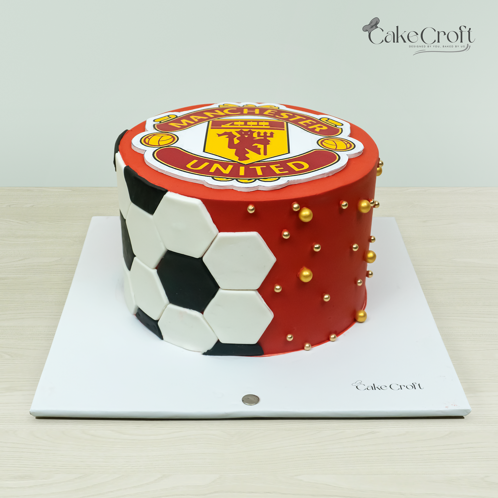 Manchester United football theme fondant cake with MUFC logo
