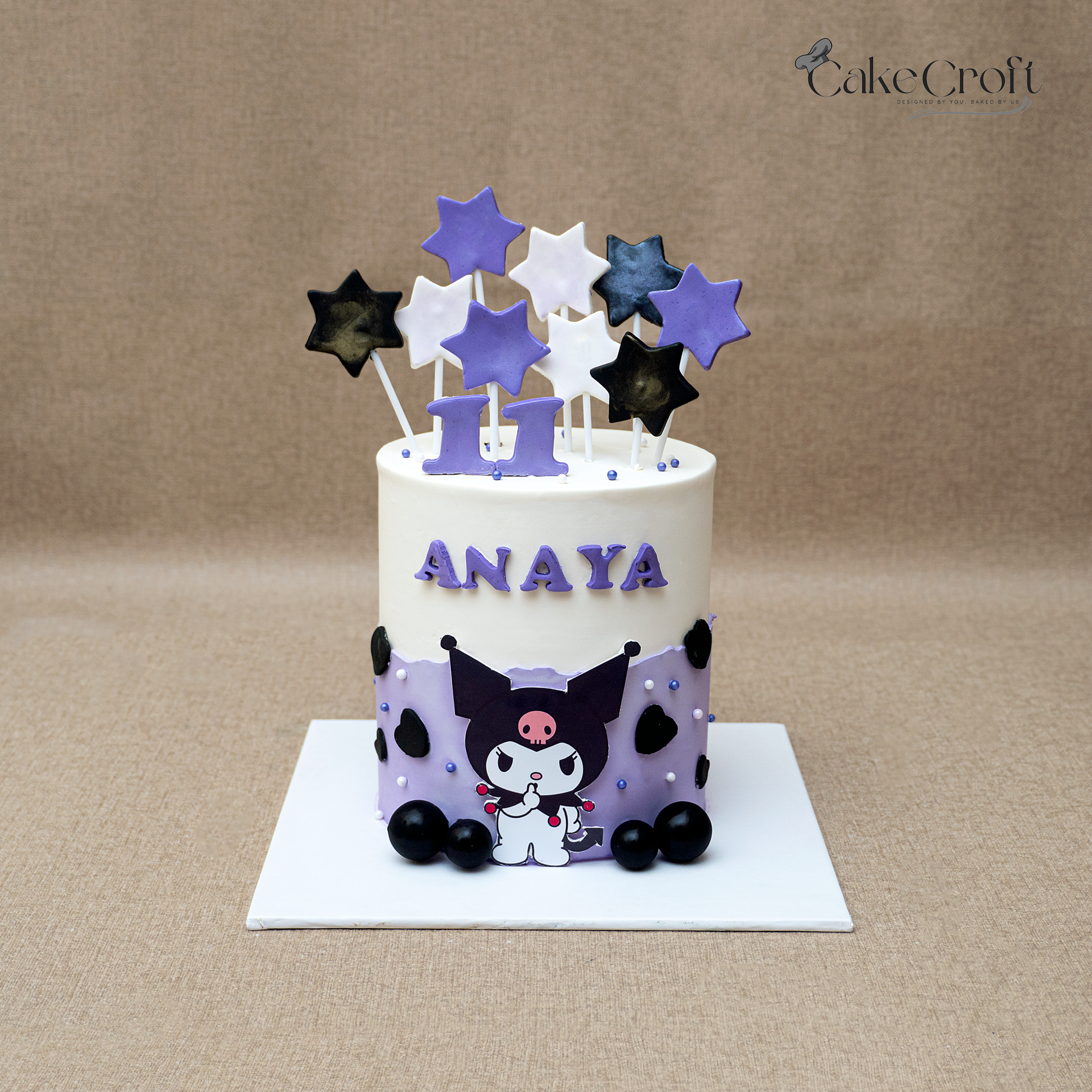 Kuromi character theme birthday cake with star toppers for kids in Dhaka