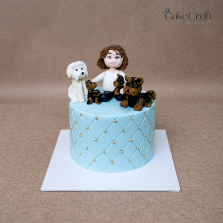 Dog lover theme fondant cake with girl figurine and puppy toppers in Dhaka