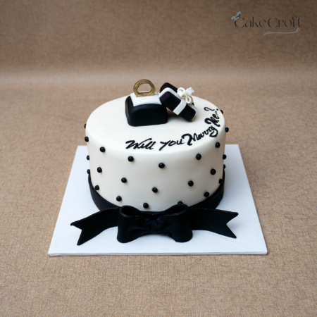 Elegant proposal cake with ring box and “Will You Marry Me” message